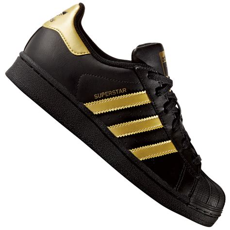 adidas schuhe schwarz goldene streifen|Schwarze, goldene adidas Superstar .